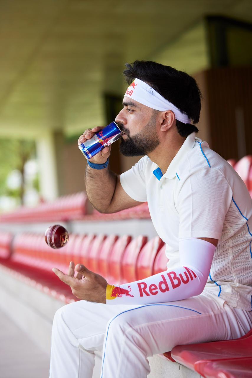 Rashid Khan sips on a can of Red Bull