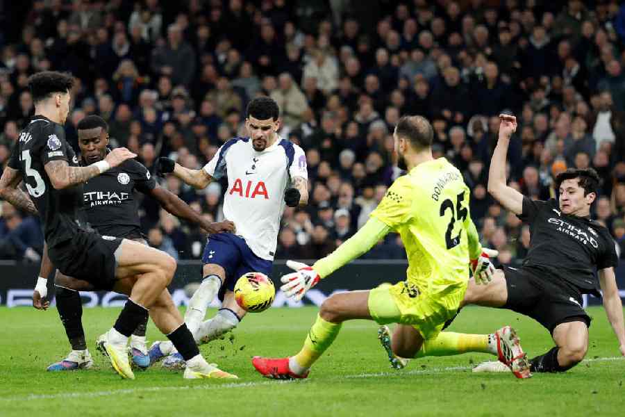 Dominic Solanke scores his and Tottenham Hotspur's first goal against Manchester City in London on Sunday.