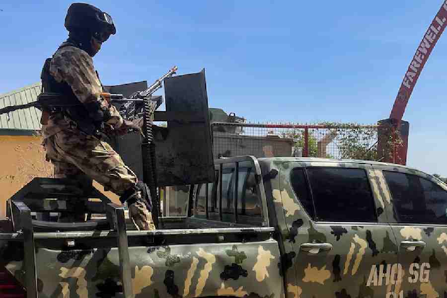 A Nigerian soldier stands on a military truck, during the tour of the Theatre Command Operation Lafiya Dole by Nigeria's Chief of Army Staff, at the Maimalari Cantonment in Maiduguri, Borno, Nigeria, November 7, 2025.
