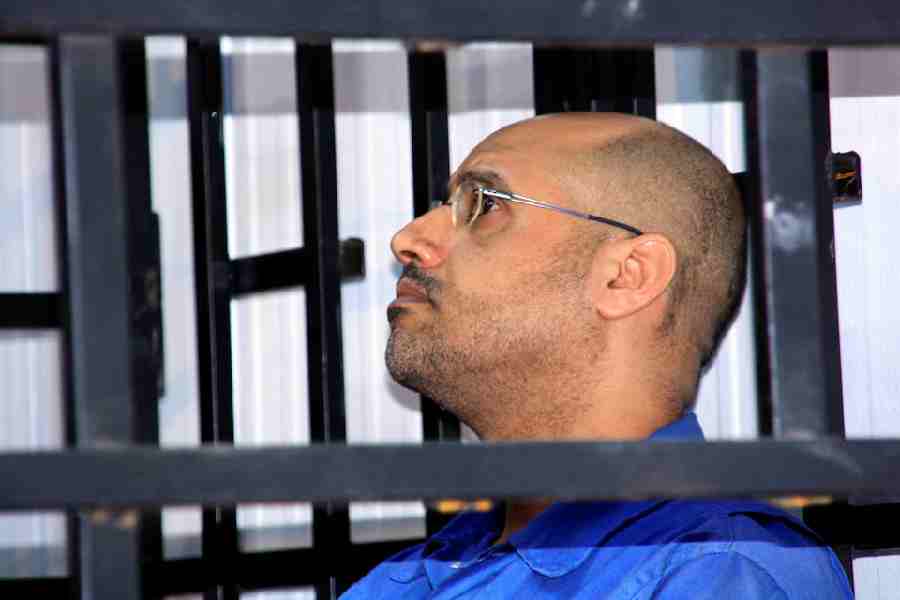 Saif al-Islam Gaddafi, son of late Libyan leader Muammar Gaddafi, attends a hearing behind bars in a courtroom in Zintan May 25, 2014.
