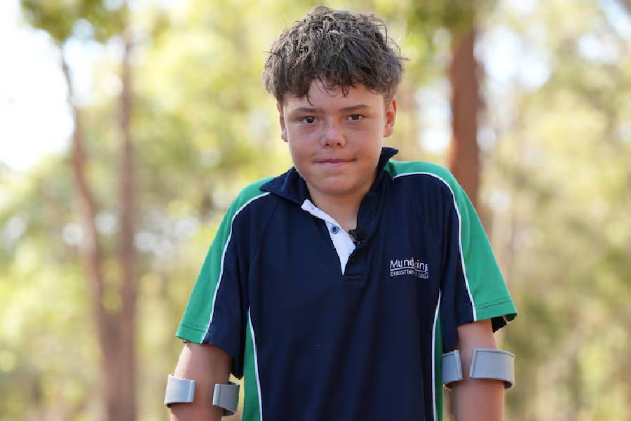 Austin swam 4 kilometres to shore to raise the alarm after being swept out to sea with his mother and siblings