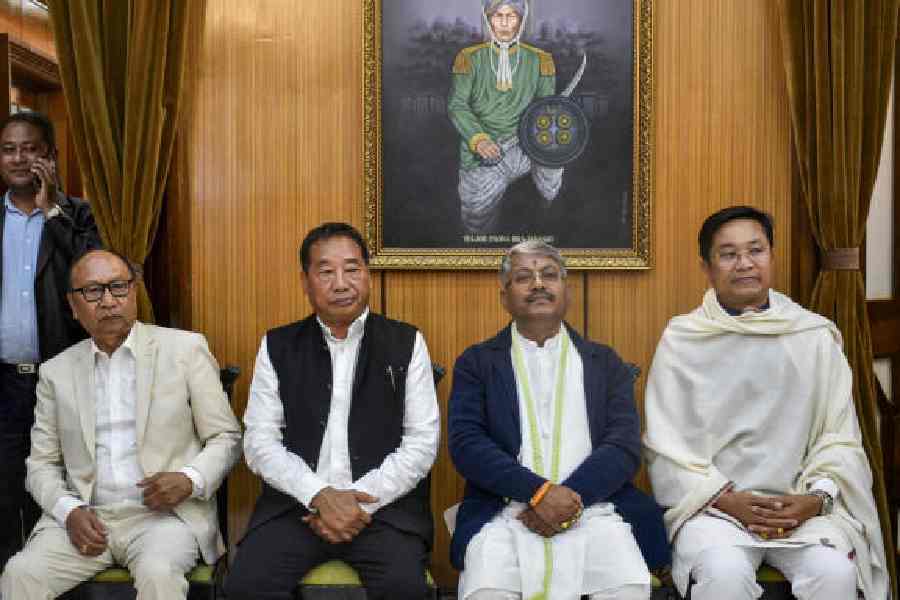 (From left) Chief minister Yumnam Khemchand Singh with one of his deputies, Losii Dikho, and ministers Govindas Konthoujam Singh and Khuraijam Loken Singh at the swearing-in ceremony of the new Manipur government on Wednesday. 