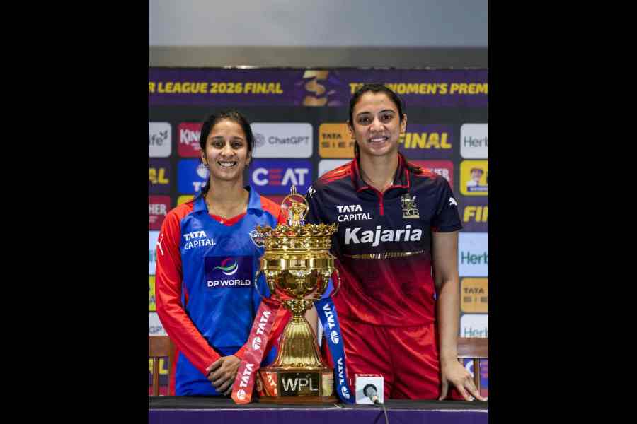 Captains Jemimah Rodrigues and (right) Smriti Mandhana pose with the Women’s Premier League trophy in Vadodara on Wednesday, the eve of the final match.