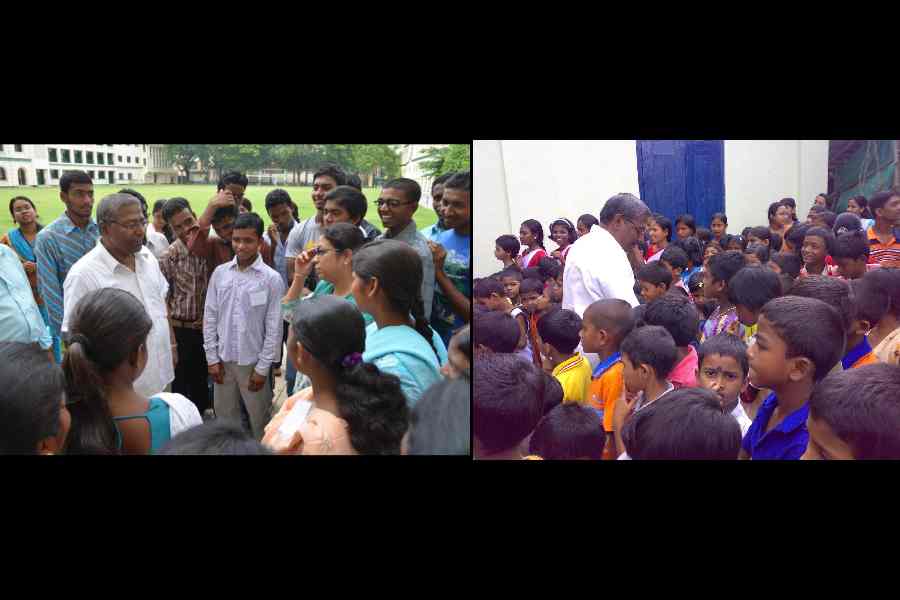 St Xavier’s University vice-chancellor Father Felix Raj (in white) and students interactwith residents of villages that the varsity has adopted