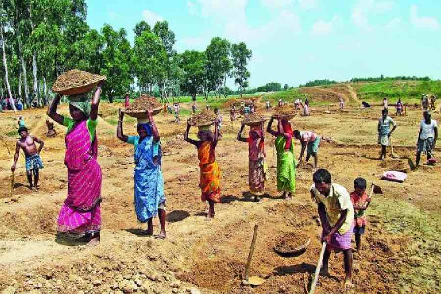 Workers dig up a pond in Birbhum under the 100-day job scheme. File picture 