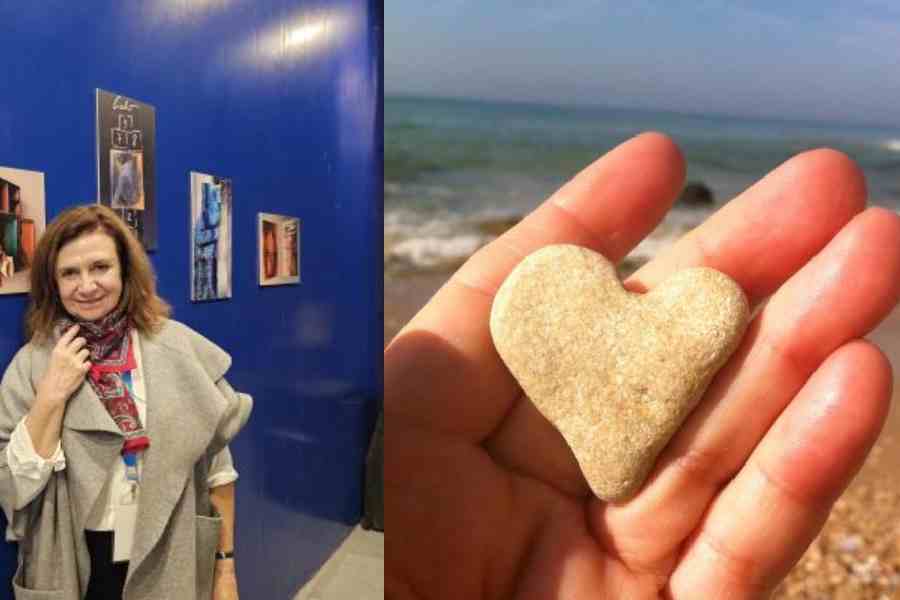 Liliana Livneh at the Argentina pavillion in front of her artwork (right) Liliana Livneh's social media display photograph with one of the heart-shaped stones she collects from seashores