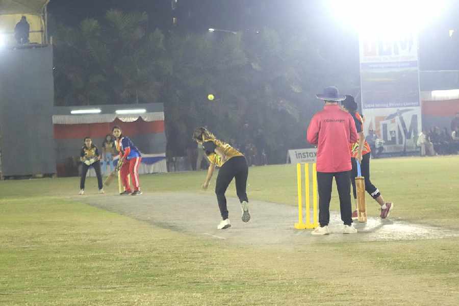 A Minions player bowls to a Scorpion batter