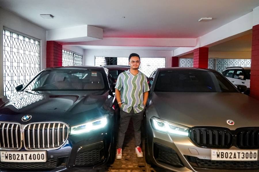 Prithveer Roychowdhury flanked by his BMW 5 and 7 series