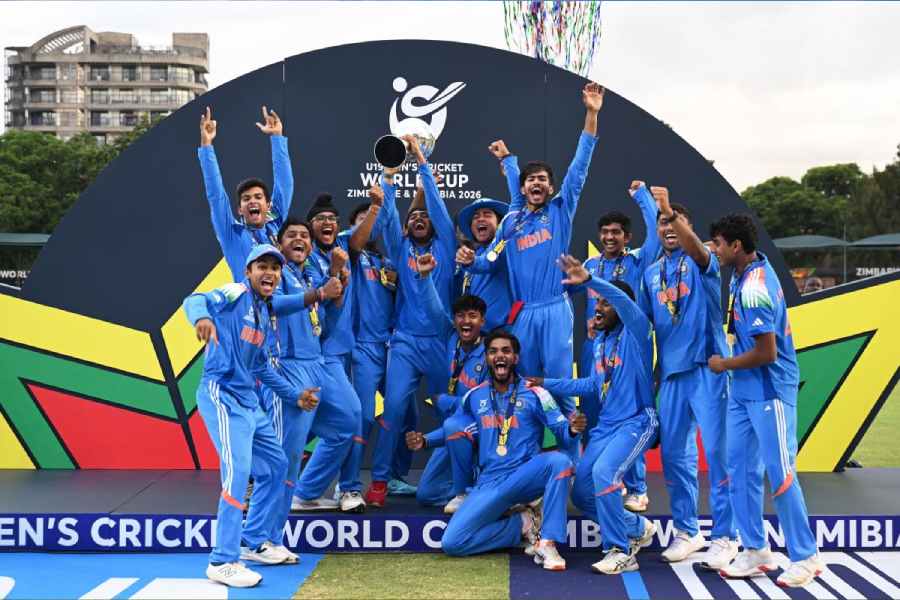 The victorious India Under-19 team lift the World Cup in Harare on Friday, after winning their sixth title by 100 runs.