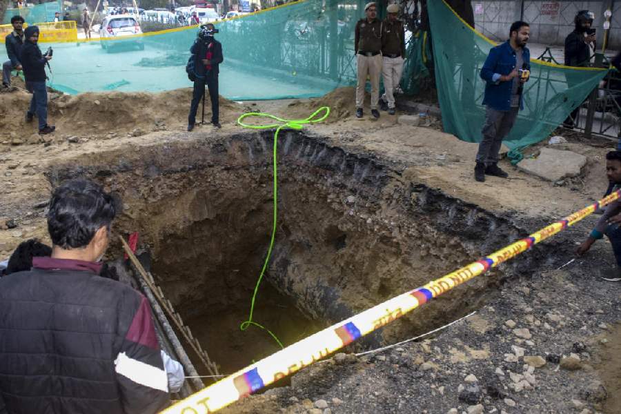 A 15-foot-deep pit dug for sewage work by the Delhi Jal Board (DJB), where a motorcyclist died after falling, barricaded during investigation by police, at Janakpuri area, in New Delhi, Friday, Feb. 6, 2026.