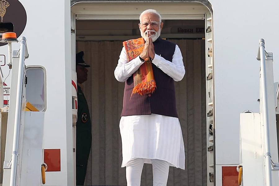 In this image released on Feb. 7, 2026, Prime Minister Narendra Modi greets as he emplanes for a two-day trip to Malaysia, in New Delhi.