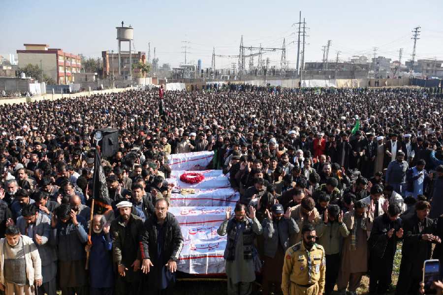 People gather to attend a funeral for victims following the suicide explosion at a Shi'ite Muslim mosque, in Islamabad, Pakistan, February 7, 2026