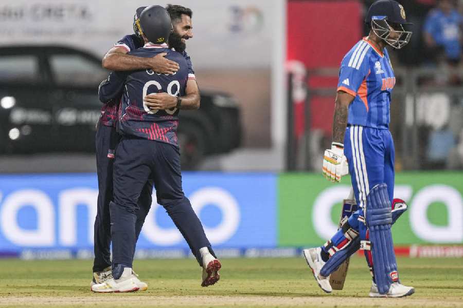 USA's Mohammad Mohsin with teammate celebrates after taking the wicket of India's Rinku Singh during the ICC Men's T20 World Cup 2026 cricket match between India and USA, at the Wankhede Stadium