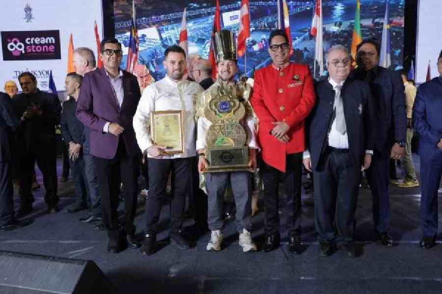 Champion of the Young Chef Olympiad, Enri Cuedari (centre), with his mentor from Albania, Mirko Monteduro (second from left), IIHM chief mentor Suborno Bose (third from right), and other jury members at the prize distribution ceremony on Friday