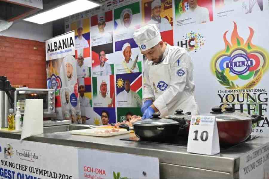 Enri Cuedari prepares a dish at the Young Chef Olympiad