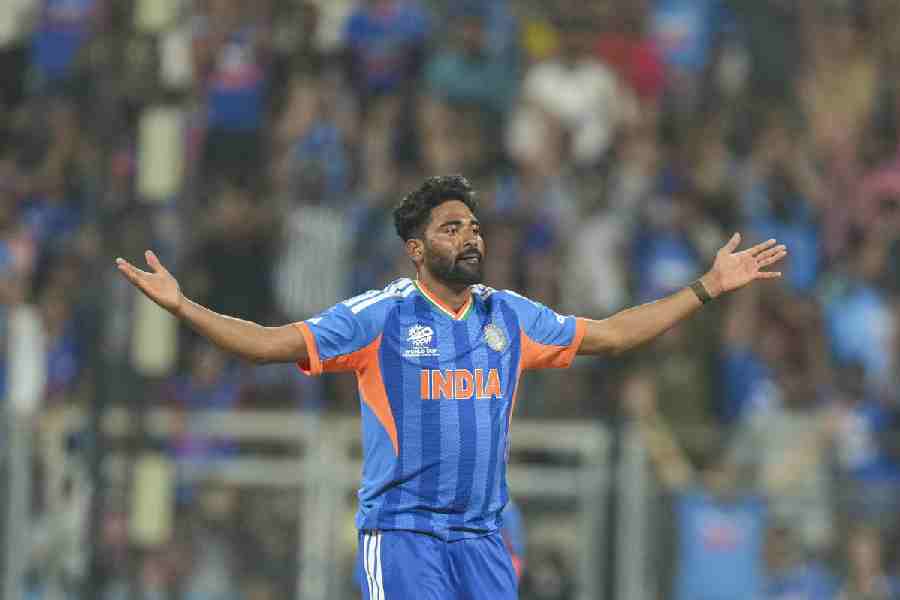 Siraj celebrates after taking the wicket of USA's Saiteja Mukkamalla during the ICC Men's T20 World Cup 2026 cricket match between India and USA, at the Wankhede Stadium, in Mumbai, Saturday, Feb. 7, 2026.