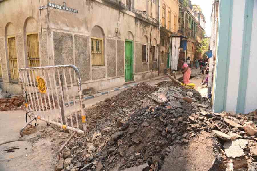 (From left) Work under way at the intersection of Kali Dutta Street and Neel Munee Sircar’s Lane near Sovabazar Metro station; on CR Avenue; and at Rajdanga            Nabapalli on Sunday afternoon