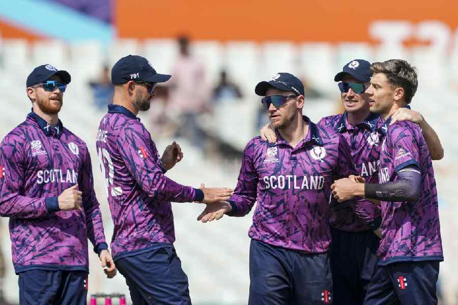 Scotland's Bradley Currie, extreme right, celebrates with teammates after taking the wicket of Italy's JJ Smuts during the ICC Men's T20 World Cup 2026 cricket match between Scotland and Italy, at Eden Gardens