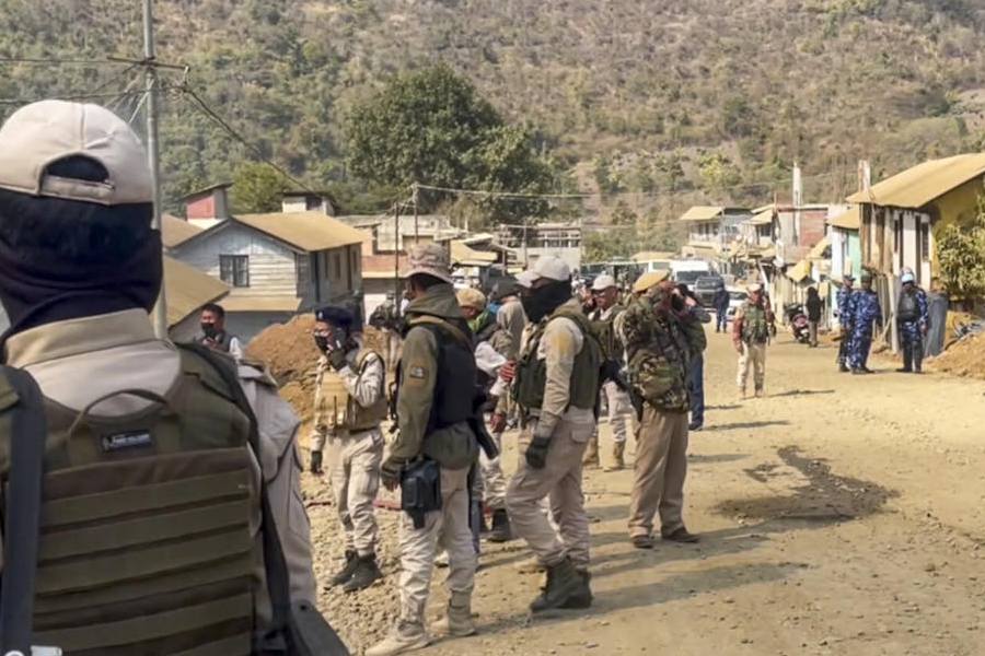 Security personnel deployed after suspected militants allegedly torched several houses, in Ukhrul district of Manipur, Monday, Feb. 9, 2026.