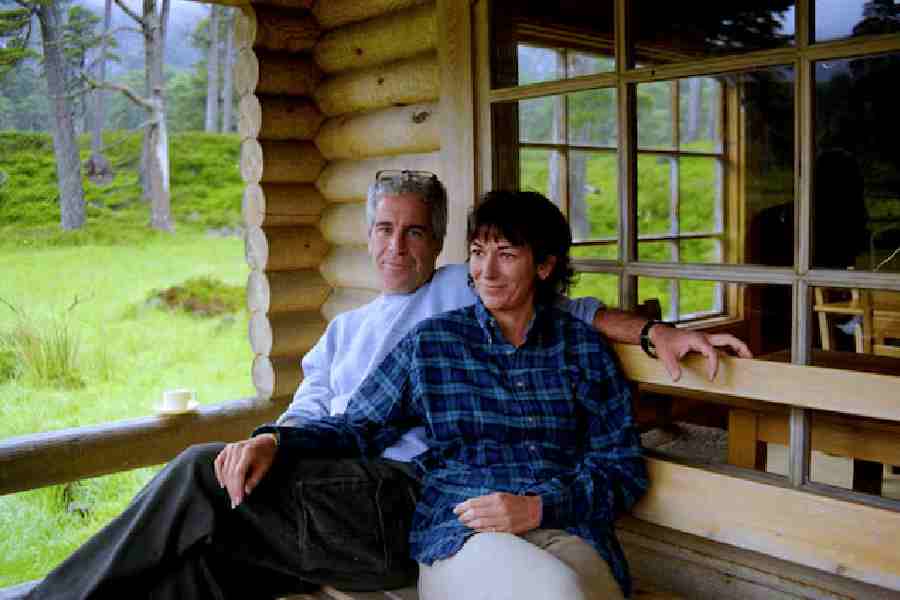 Ghislaine Maxwell and Jeffrey Epstein are seen in this image released by the Department of Justice in Washington, D.C., U.S., on December 19, 2025 as part of a new trove of documents from its investigations into the late financier and convicted sex offender Jeffrey Epstein.