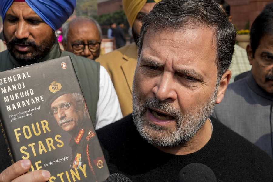 Rahul Gandhi speaks to the media, as he shows a copy of the unpublished "memoir" of former Army chief M M Naravane