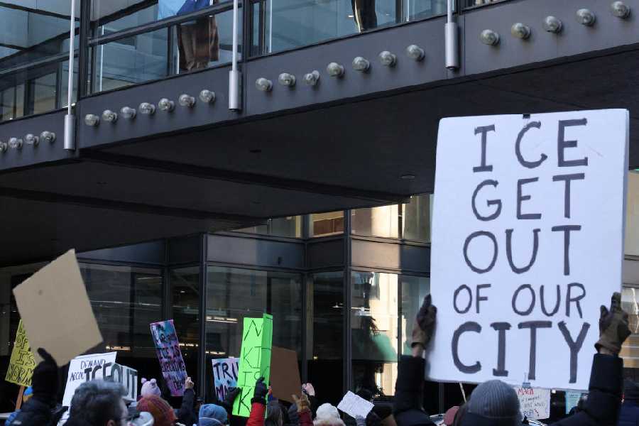 Protesters take part in a march against U.S. Immigration and Customs Enforcement (ICE) through downtown Minneapolis