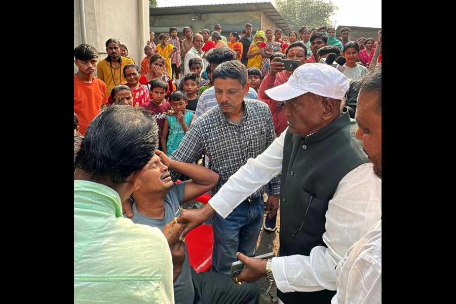 Trinamool leader Shankar Malakar visits the bereaved family members at Matigara near Siliguri on Tuesday