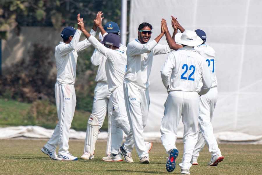 Shahbaz Ahmed celebrates with teammates after one of his four wickets in Kalyani on Tuesday.