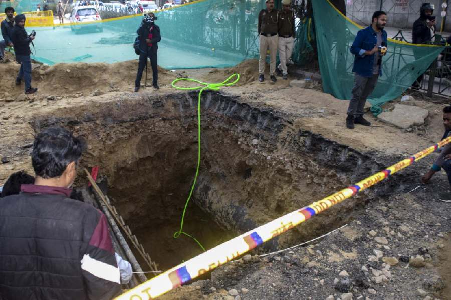 A 15-foot-deep pit dug for sewage work by the Delhi Jal Board (DJB), where a motorcyclist died after falling, barricaded during investigation by police, at Janakpuri area, in New Delhi, Friday, Feb. 6, 2026.