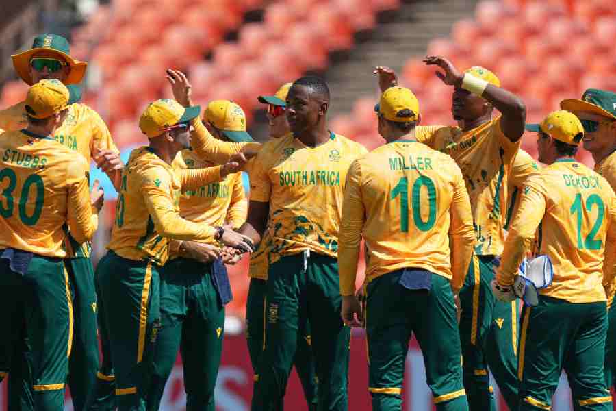 South Africa's Kagiso Rabada, centre, celebrates the dismissal of Afghanistan's Sediqullah Atal during the T20 World Cup cricket match between Afghanistan and South Africa in Ahmedabad, India, Wednesday, Feb. 11, 2026.