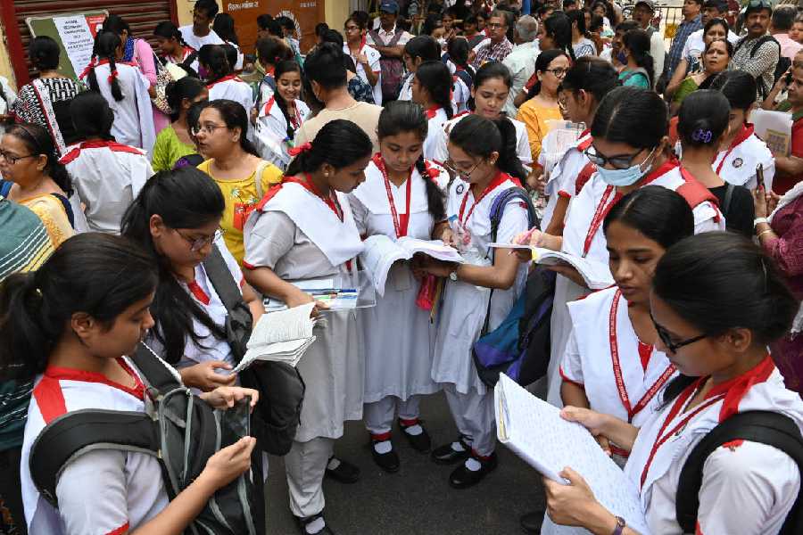 HS candidates outside an examination centre in the city.