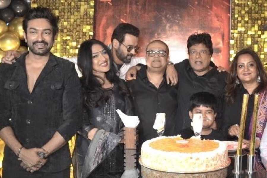 Everyone got together for the cake-cutting moment