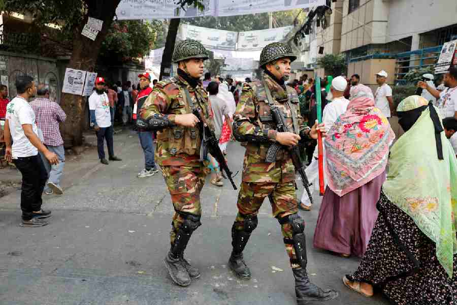 Members of the army patrol outside the polling station during the 13th general election in Dhaka, Bangladesh, February 12, 2026.