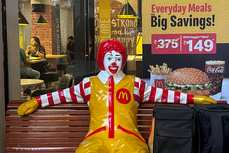 FILE PHOTO: A statue of Ronald McDonald, a mascot of the McDonald\'s fast-food restaurant chain is seen outside the restaurant in Mumbai