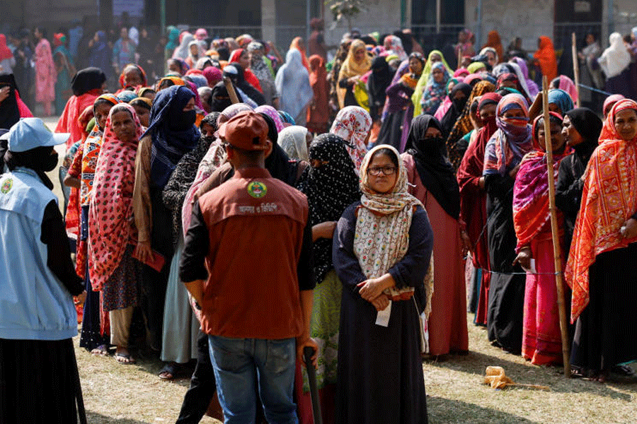 Voters stand in the queue to cast their vote at a polling station during the 13th general election in Dhaka, Bangladesh, February 12, 2026.