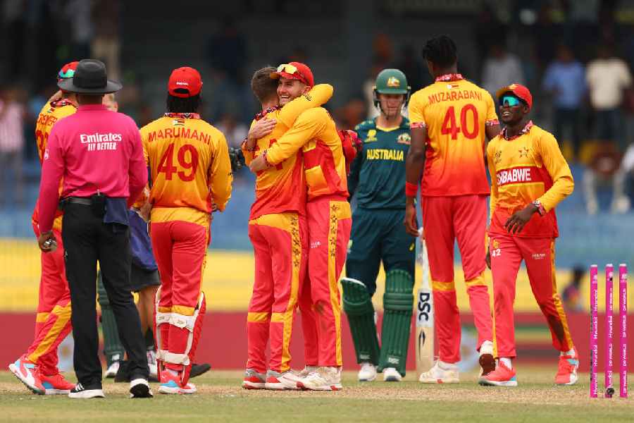 Zimbabwe players celebrate their 23-run victory over Australia in a Group B match  of the T20 World Cup in Colombo on Friday.