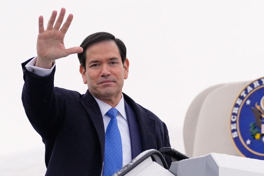 US Secretary of State Marco Rubio waves as he departs Munich International Airport in Munich, Germany, Sunday, Feb. 15, 2026, after attending the Munich Security Conference.