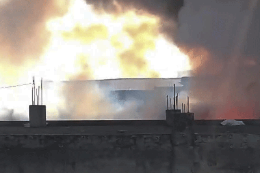 In this screengrab from a video posted on Feb. 16, 2026, Thick flames and billowing smoke rise from a chemical factory at the Khushkhera-Karouli Industrial Area, in Bhiwadi, Rajasthan. Officials said seven workers were killed and two others were feared trapped after a fire broke out at the unit.