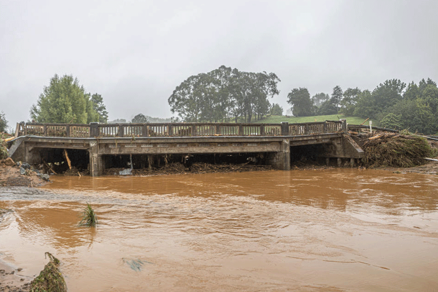 Floodwaters flow through Puketotara after heavy rain and wild winds in Puketotara