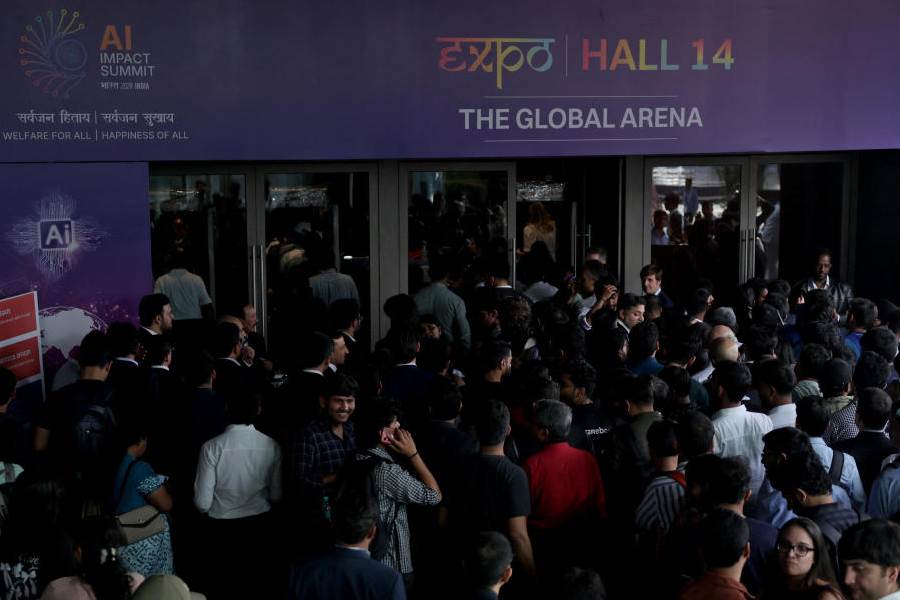 Visitors crowd to enter a hall at a venue for India AI Impact Summit at Bharat Mandapam in New Delhi, India, February 16, 2026.