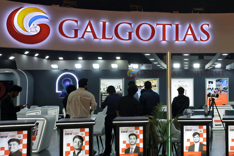 Visitors stand at the Galgotias University kiosk at Bharat Mandapam, one of the venues for AI Impact Summit, in New Delhi, India, February 18, 2026.