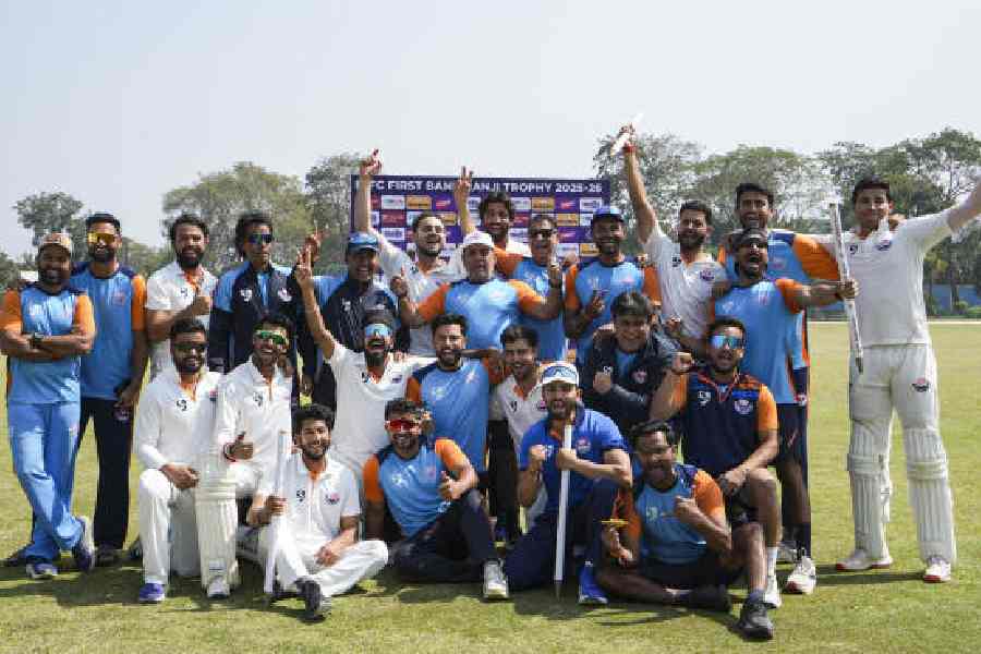 The victorious Jammu & Kashmir team and support staff after beating Bengal to enter the Ranji Trophy final, in Kalyani on Wednesday.