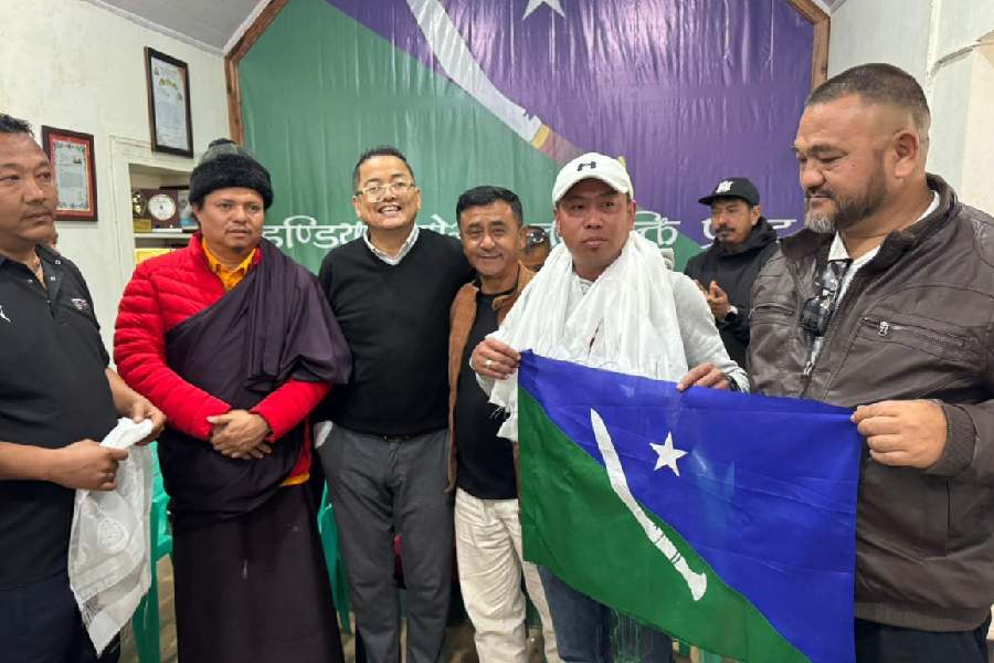 Ajoy Edwards (in black sweater), the president of the Indian Gorkha Janashakti Front, welcomes new joinees to the party in Darjeeling on Tuesday.