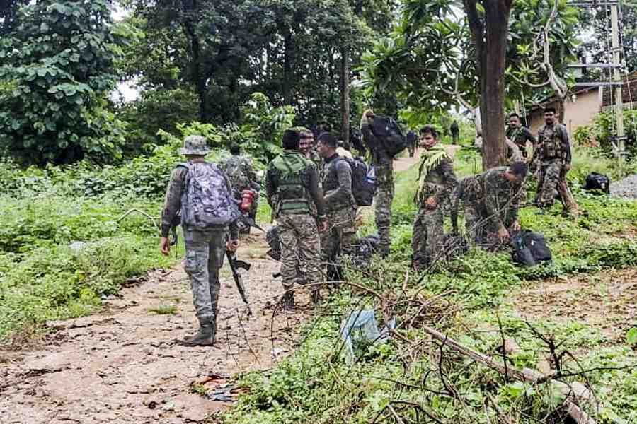 Security personnel near the site after a Maoist