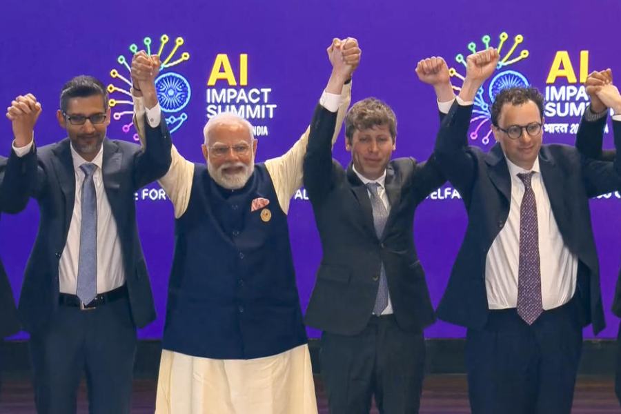 (From right) Rival AI firm chiefs Dario Amodei and Sam Altman avoid holding hands as others, including Prime Minister Narendra Modi and Alphabet CEO Sundar Pichai, display bonhomie at the AI Impact Summit on Thursday.
