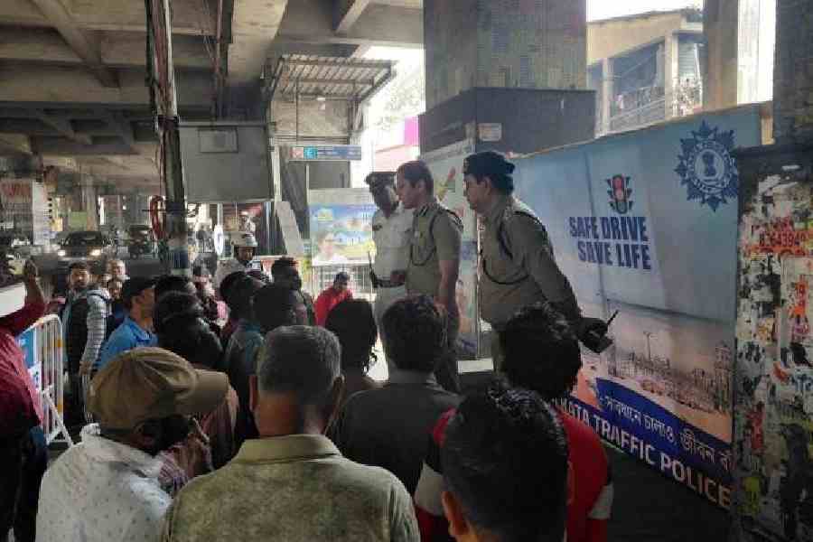 Police officers address commuters and drivers on Thursday