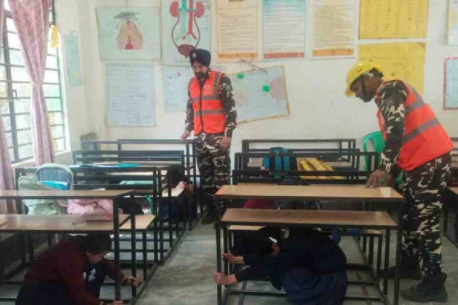 Personnel of the 36th battalion of the Sashastra Seema Bal (SSB) conduct a mock drill for students at a school in Gyalshing district, Sikkim, on Tuesday. Picture courtesy: Government of Sikkim