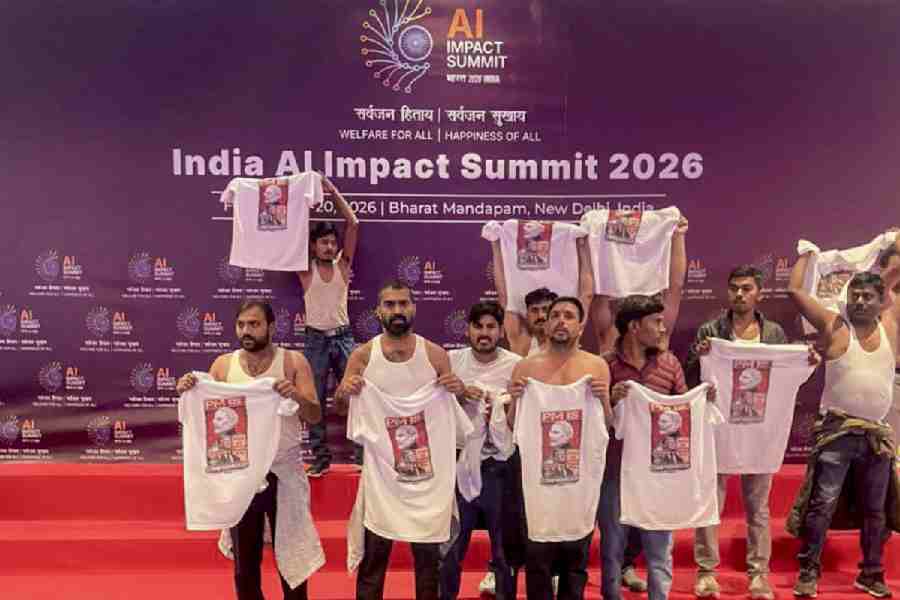 Indian Youth Congress workers stage a protest during the India AI Impact Summit 2026 at Bharat Mandapam, in New Delhi.