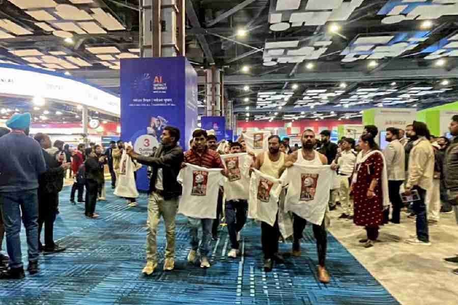 Indian Youth Congress workers stage a protest at the AI Impact Summit in New Delhi on Friday.