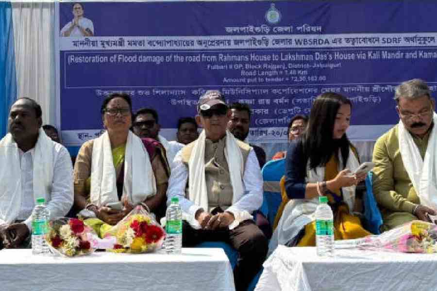 Siliguri mayor Gautam Deb (centre) at the foundation-laying of the construction of the road at Paschim Dhantala near Siliguri on Friday. Picture by Passang Yolmo